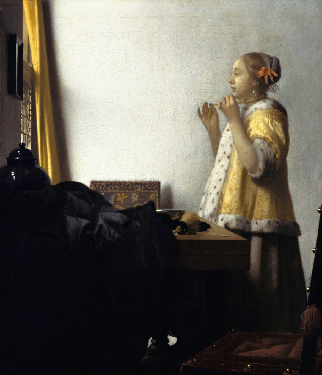 Fiatal nő gyöngy nyaklánccal alkotó: Jan Vermeer van Delft